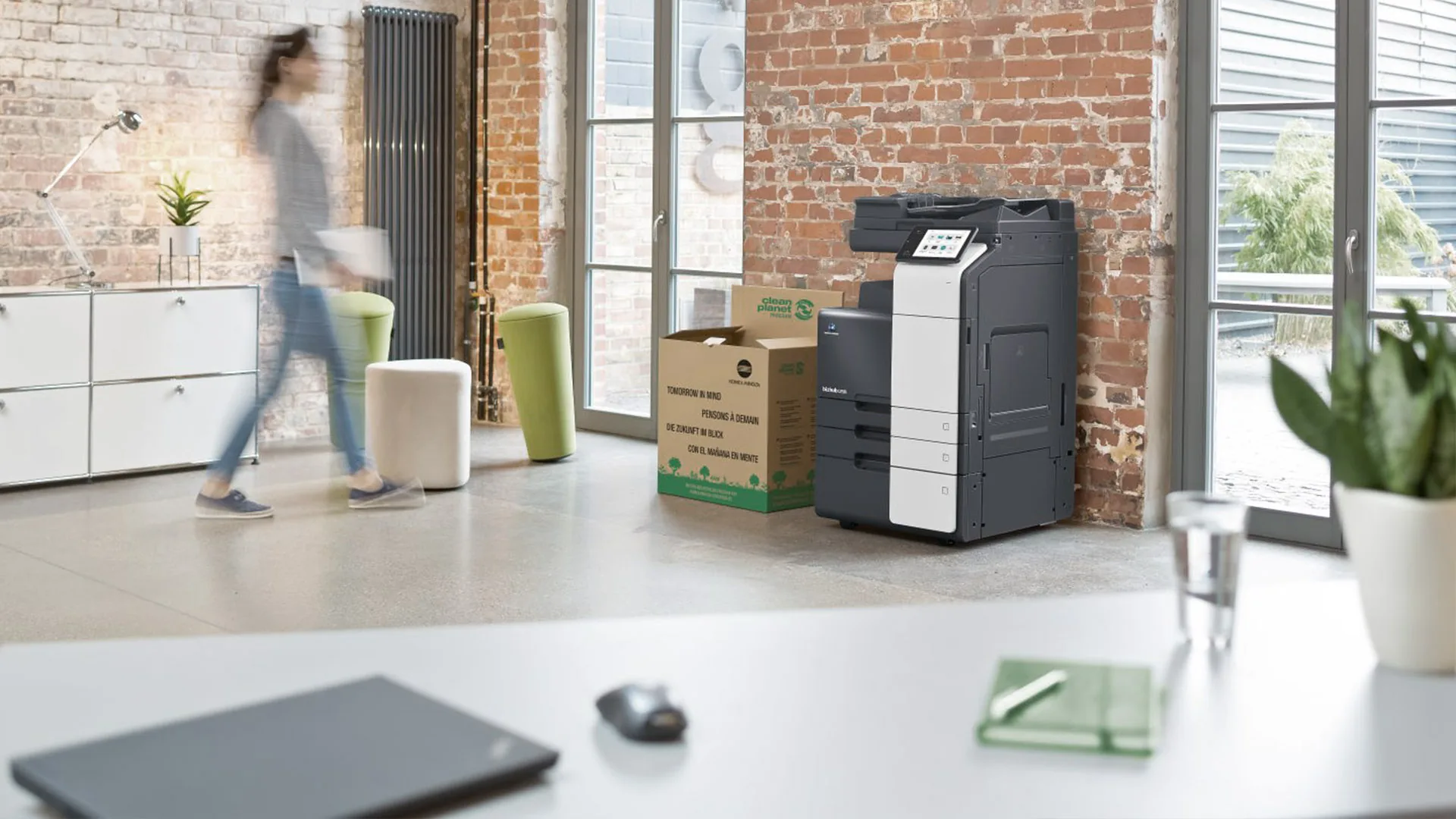 Colleagues using a centrally managed multi-location printing service